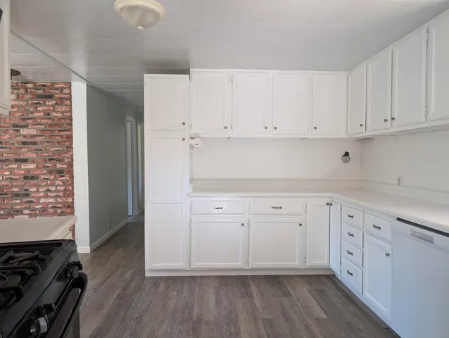 a view of cabinets and wooden floor