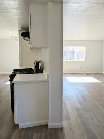 a view of a sink and a microwave in a room