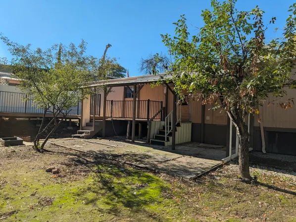 a view of a backyard of the house