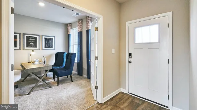a view of a livingroom with furniture and a window