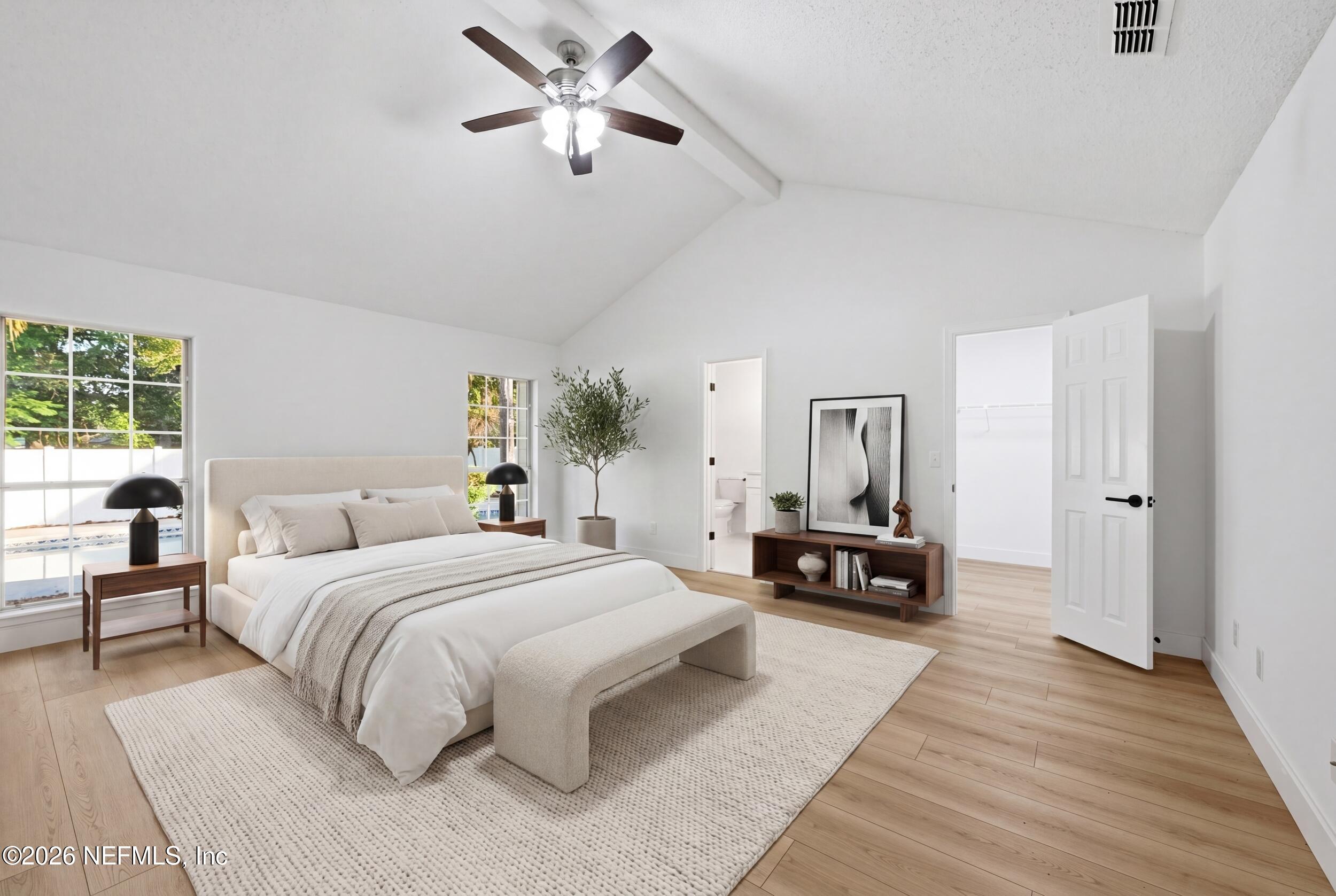 3286 Marbon Road Jacksonville, FL 32223 - Photo 22 of 36 a bedroom with a bed and wooden floor