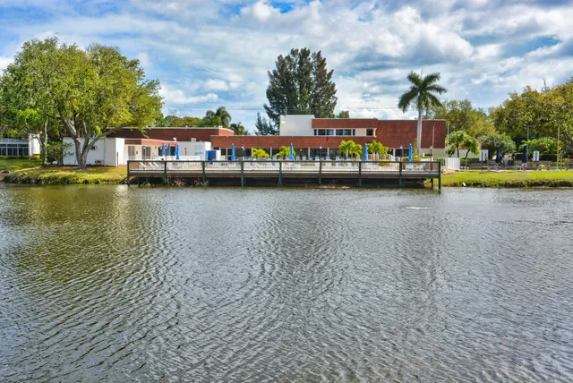 a front view of a house with a lake view