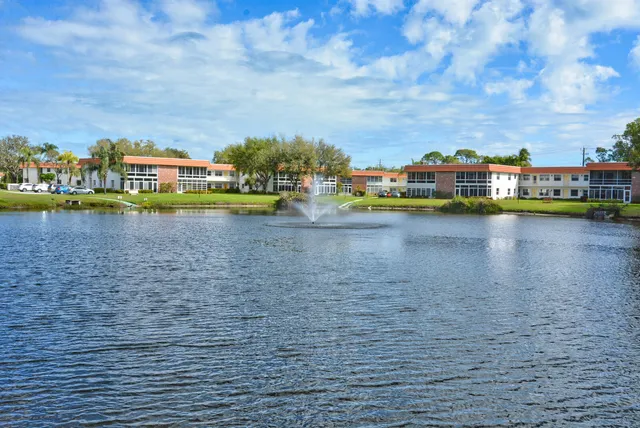 a view of swimming pool and lake in back