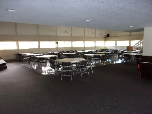 a kitchen with lots of table and chairs