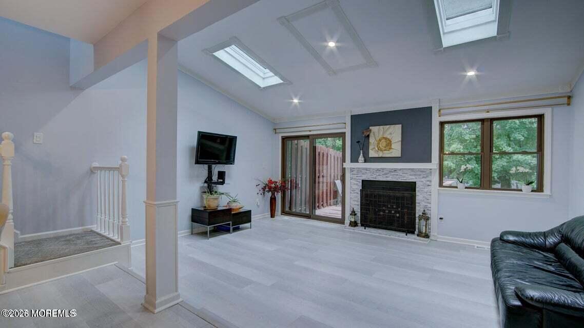 57 Chestnut Way Manalapan, NJ 07726 - Photo 11 of 20 a living room with furniture and a fireplace