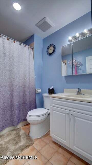 57 Chestnut Way Manalapan, NJ 07726 - Photo 15 of 20 a bathroom with a sink a toilet and a mirror