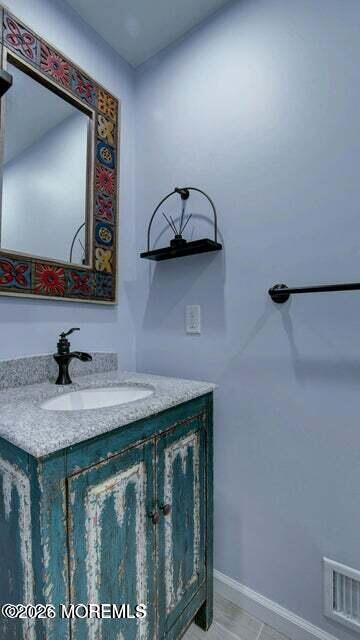 57 Chestnut Way Manalapan, NJ 07726 - Photo 6 of 20 a bathroom with a granite countertop sink and a mirror
