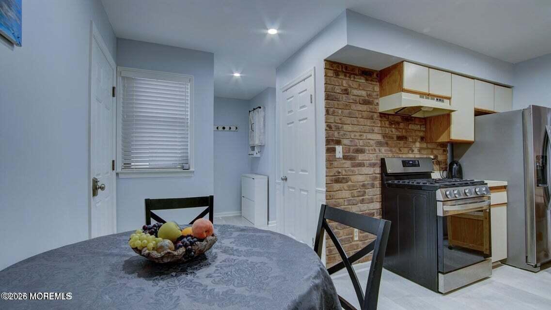 57 Chestnut Way Manalapan, NJ 07726 - Photo 8 of 20 a living room with furniture and a fireplace