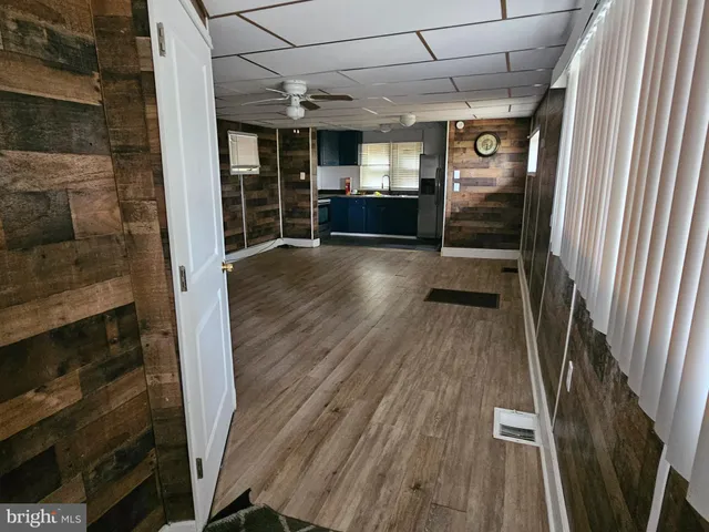 a view of a porch with wooden floor