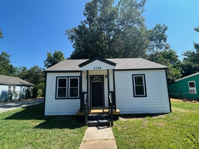 3786 Longfellow Road Memphis, TN 38108 - Photo 15 of 15 a front view of a house with a yard