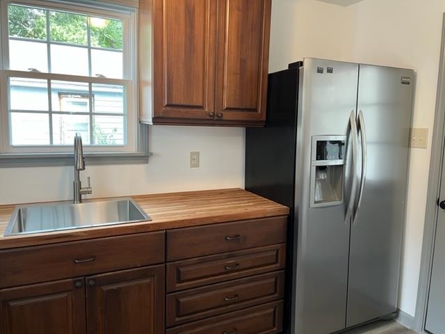 3786 Longfellow Road Memphis, TN 38108 - Photo 3 of 15 a kitchen with stainless steel appliances granite countertop a refrigerator and a sink