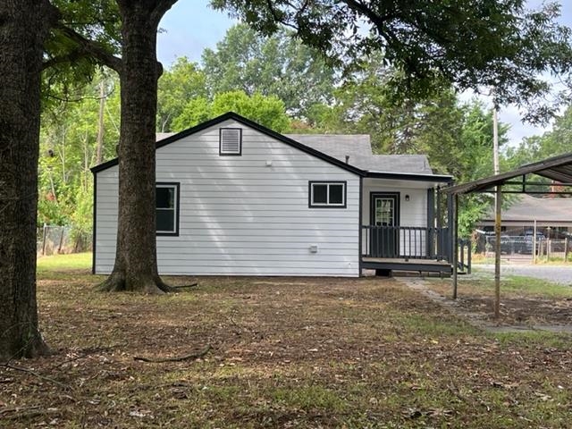3786 Longfellow Road Memphis, TN 38108 - Photo 10 of 15 a backyard of a house with lots of green space