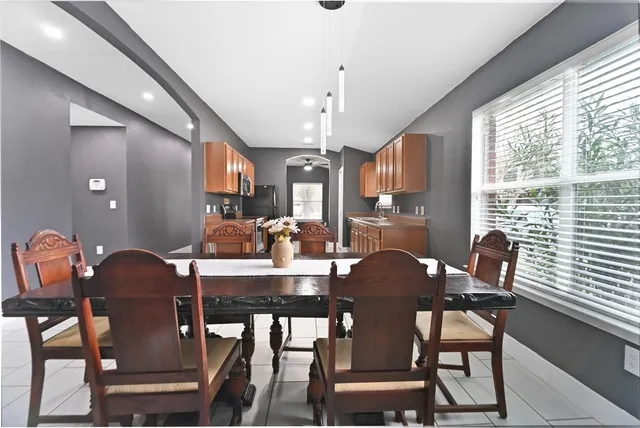 a view of a dining room with furniture window and outside view