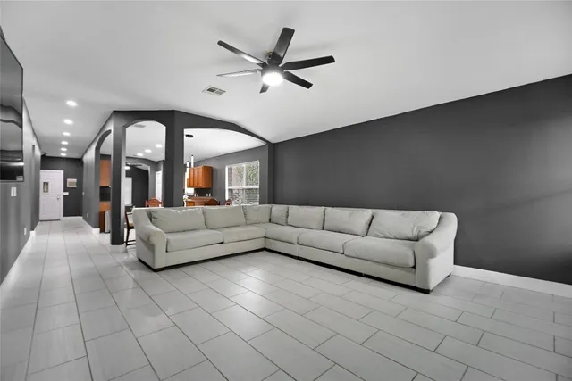 a living room with furniture and a large window