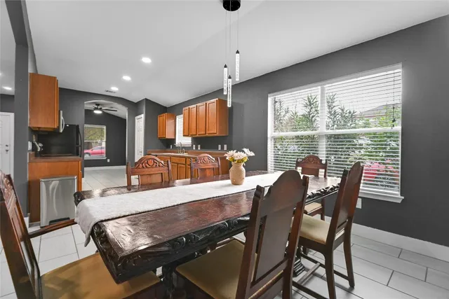 a view of a dining room with furniture window and outside view