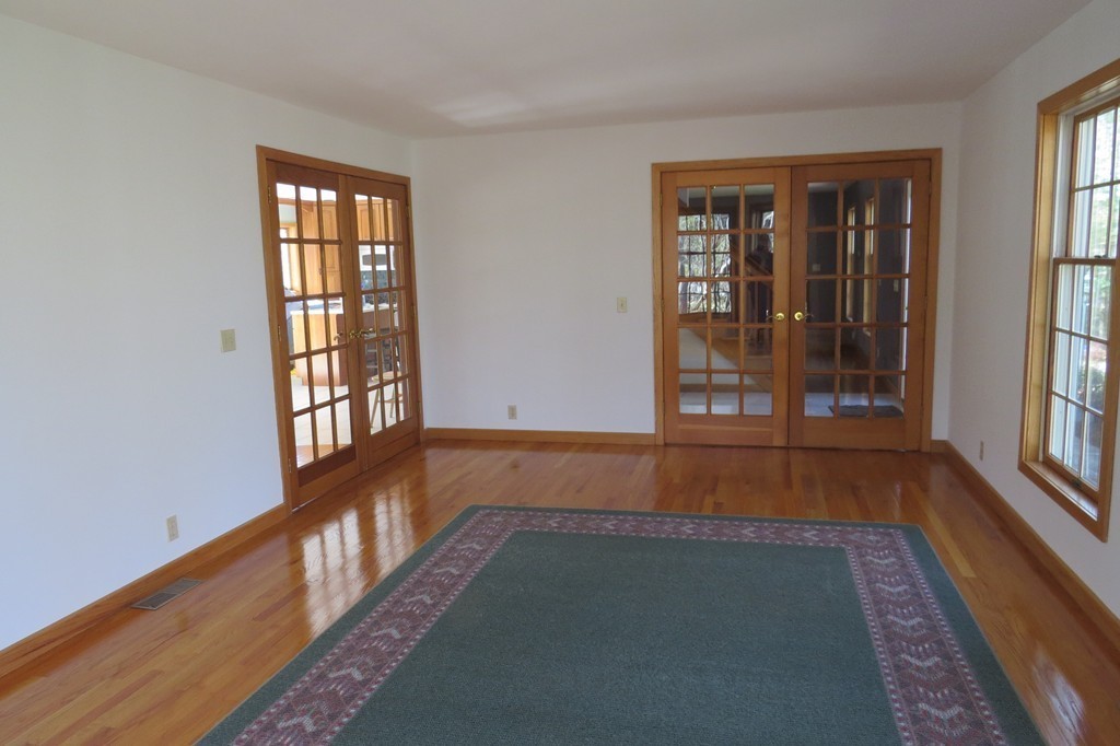 183 Maple Ridge Road Northampton, MA 01062 - Photo 11 of 30 wooden floor in an empty room with a window