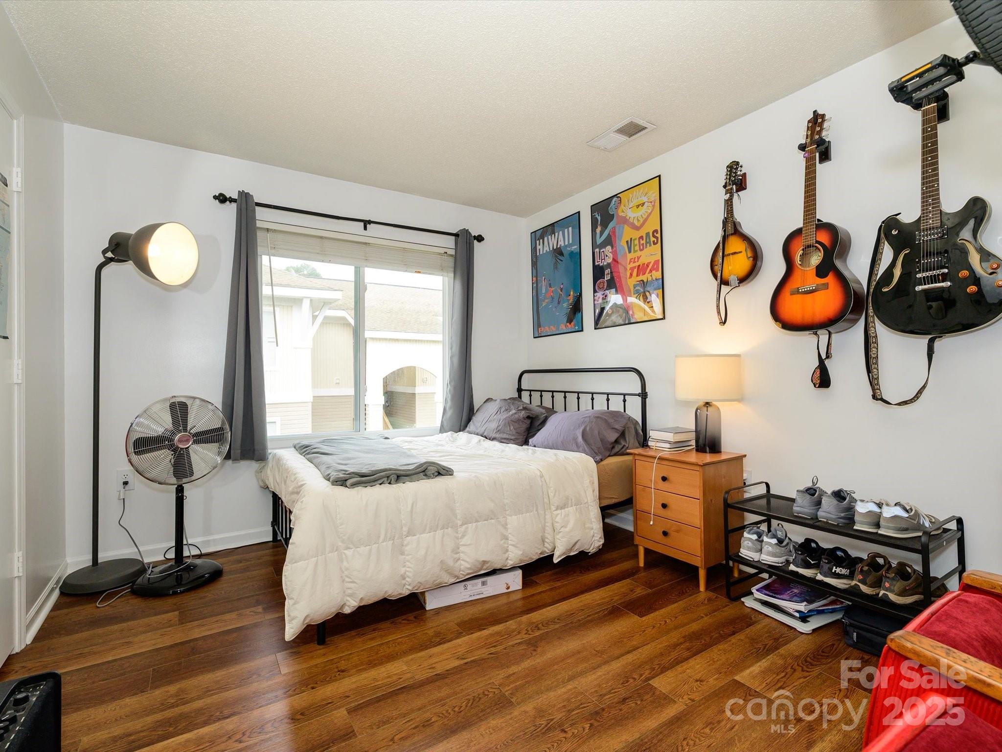 10005 Graduate Lane, Unit K Charlotte, NC 28262 - Photo 19 of 25 a bedroom with bed and a window