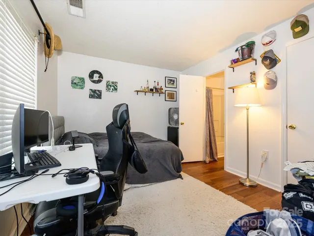 a bedroom with furniture and a window