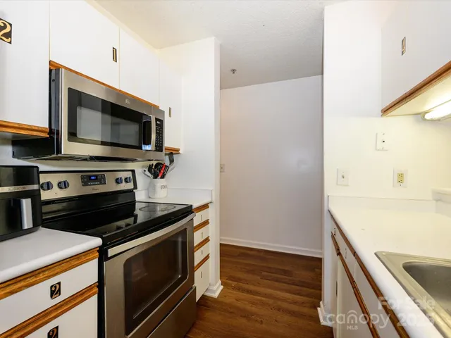 a kitchen with a stove and a microwave