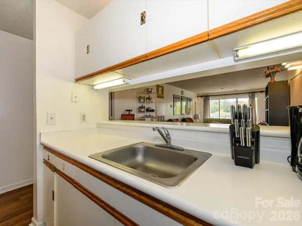 a kitchen with a sink and a refrigerator