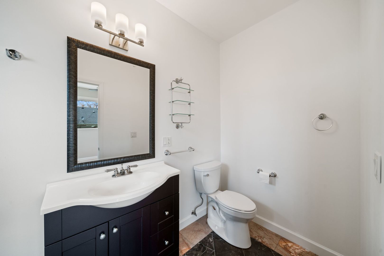 701 Oakton Street Park Ridge, IL 60068 - Photo 29 of 59 a bathroom with a toilet sink and mirror