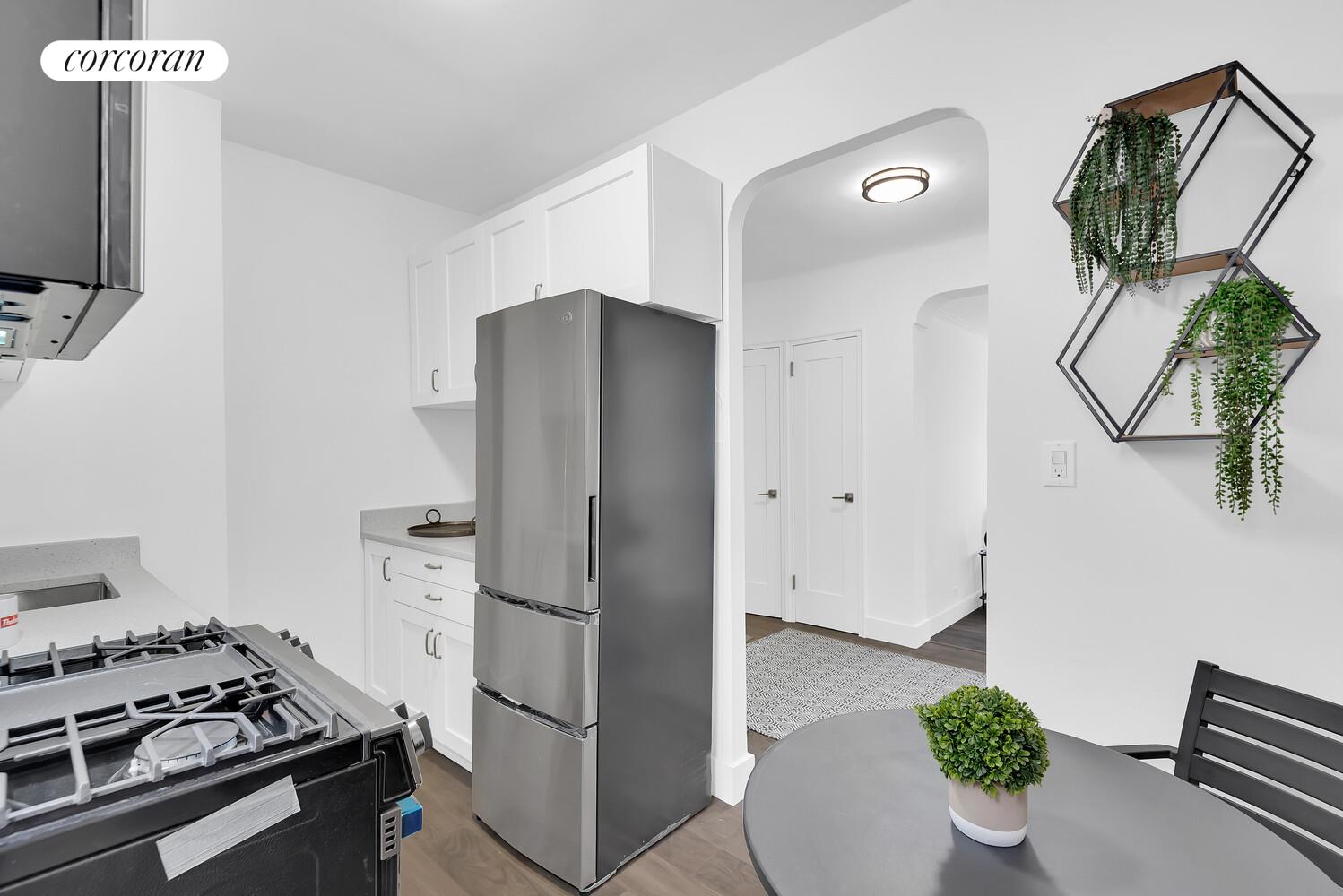 3245 Perry Avenue, Unit 4B Bronx, NY 10467 - Photo 2 of 8 a kitchen with stainless steel appliances a refrigerator and a stove