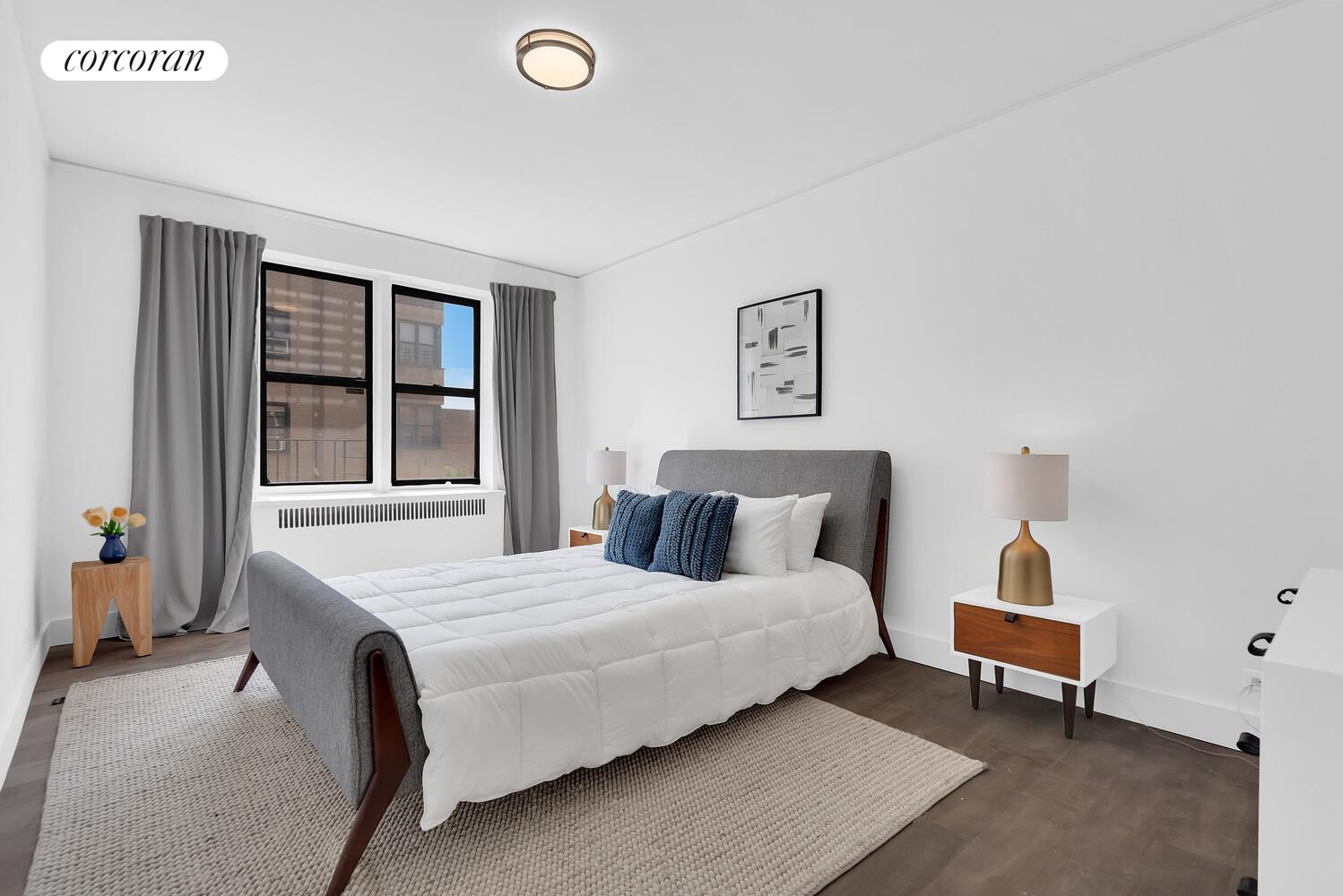 3245 Perry Avenue, Unit 4B Bronx, NY 10467 - Photo 4 of 8 a bedroom with a bed and wooden floor