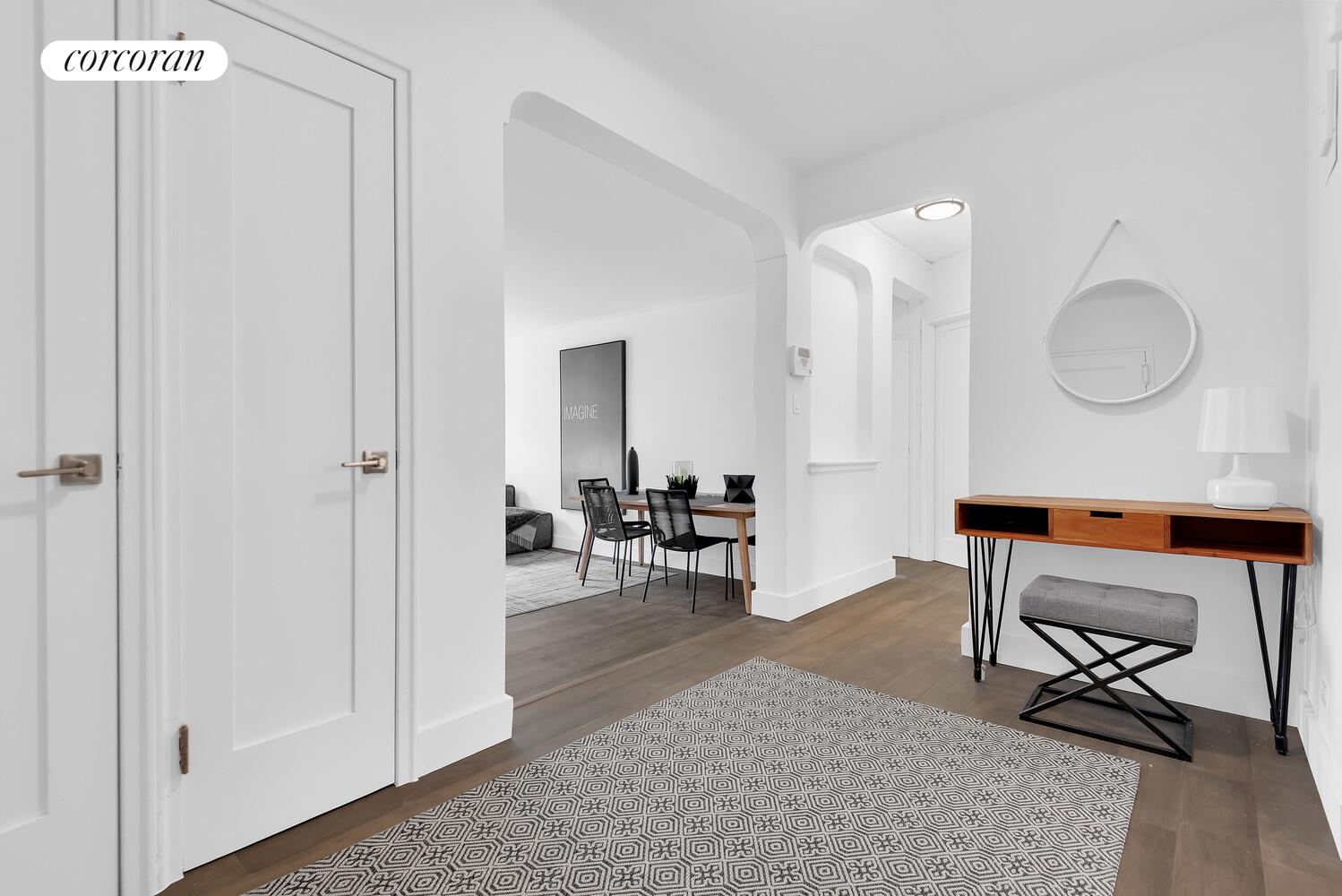 3245 Perry Avenue, Unit 4B Bronx, NY 10467 - Photo 6 of 8 a living room with furniture a rug and a painting on the wall