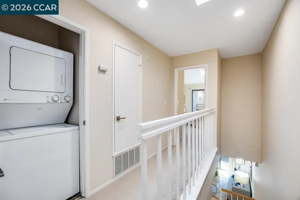 a view of hallway with washer and dryer
