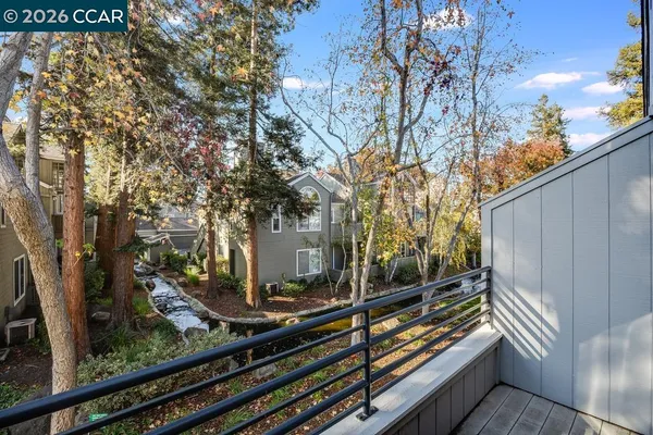 a view of a back yard from a balcony
