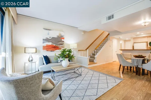 a living room with furniture and a table