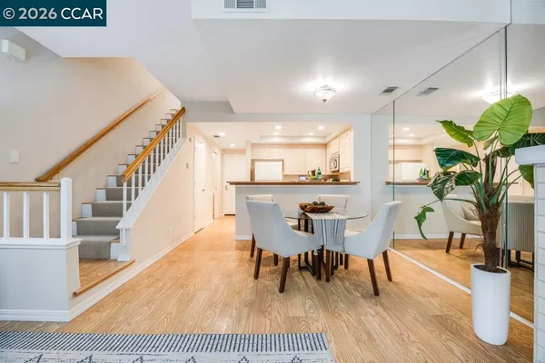 a view of a dining room with furniture and wooden floor