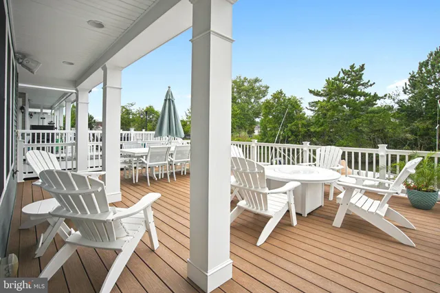 a view of a chairs and table on the deck