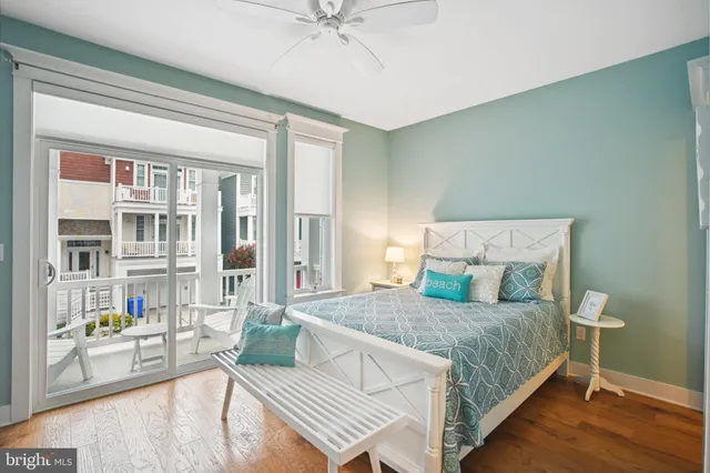 a view of a hallway with furniture and front door