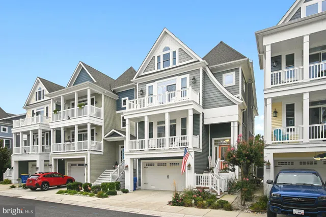 a front view of a residential apartment building with a yard