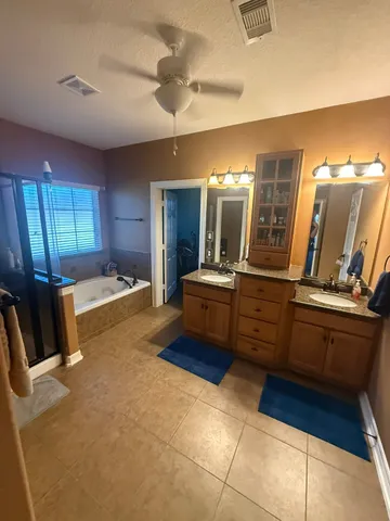 a utility room with sink dryer and washer