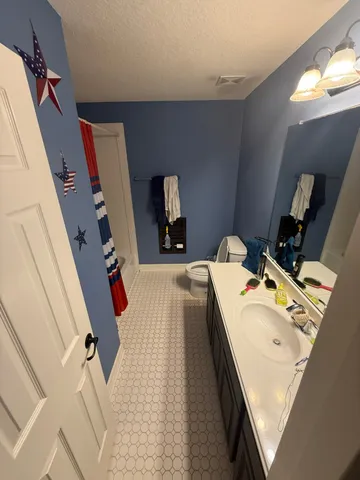 a view of living room with furniture and a flat screen tv