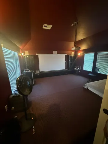 a view of a livingroom with furniture and hardwood floor
