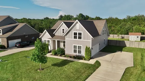 a aerial view of a house with a yard