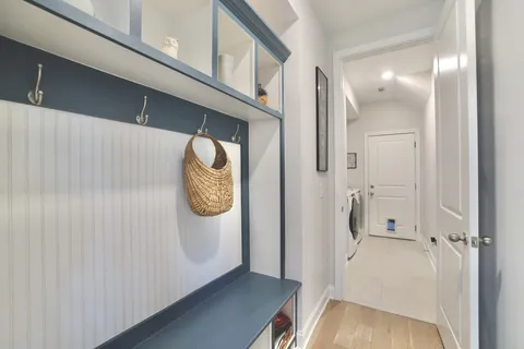 a view of an entryway with wooden floor