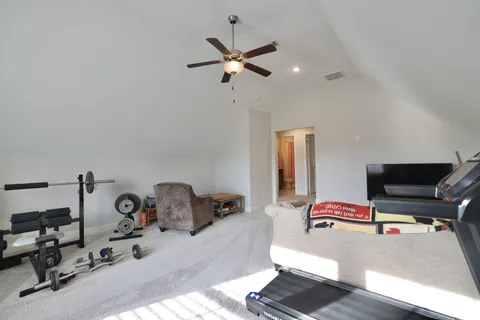 a room with gym equipment and a window