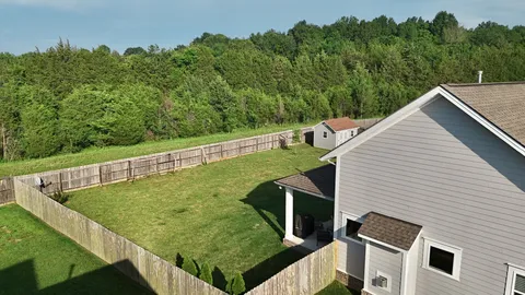 a view of a two chairs in the balcony