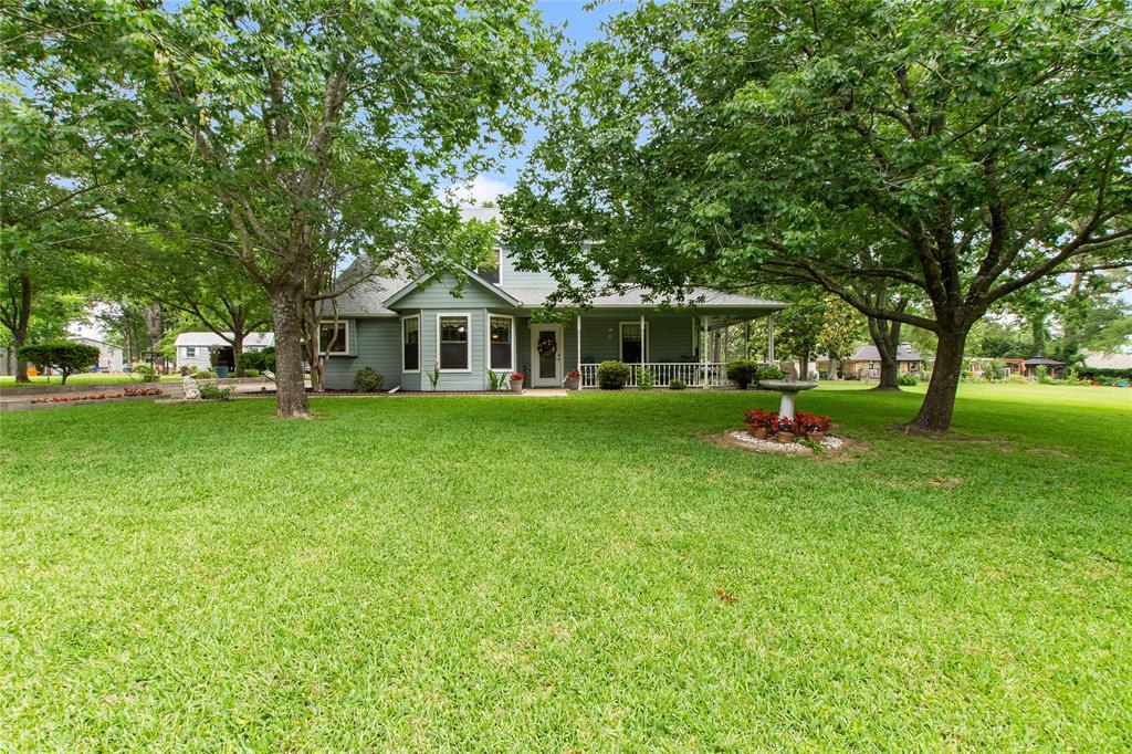 455 Stirrup Ranch Road Trinidad, TX 75163 - Photo 1 of 20 a front view of a house with a garden and trees