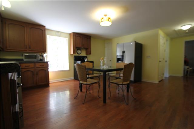 4749 Grays Point Road Joelton, TN 37080 - Photo 6 of 20 Large kitchen with hardwood floors and nice appliances. Stove, Dishwasher and Refrigerator remain. Kitchen does have a pantry!