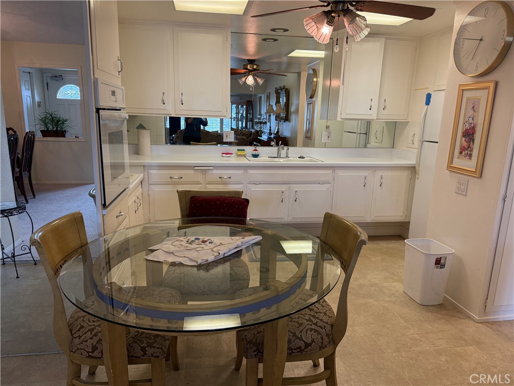 1441 Homewood Road Seal Beach, CA 90740 - Photo 11 of 25 a dining room with furniture and wooden floor
