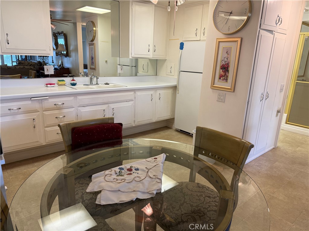 1441 Homewood Road Seal Beach, CA 90740 - Photo 13 of 25 a living room with furniture and a table