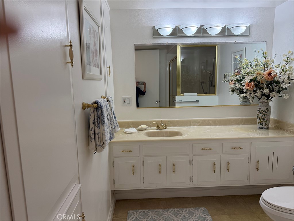 1441 Homewood Road Seal Beach, CA 90740 - Photo 19 of 25 a bathroom with a sink and a mirror