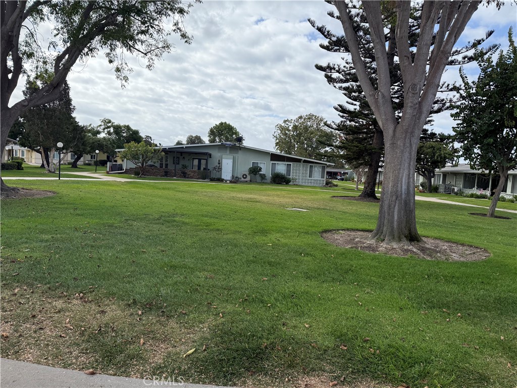 1441 Homewood Road Seal Beach, CA 90740 - Photo 25 of 25 a big yard with swimming pool and green space
