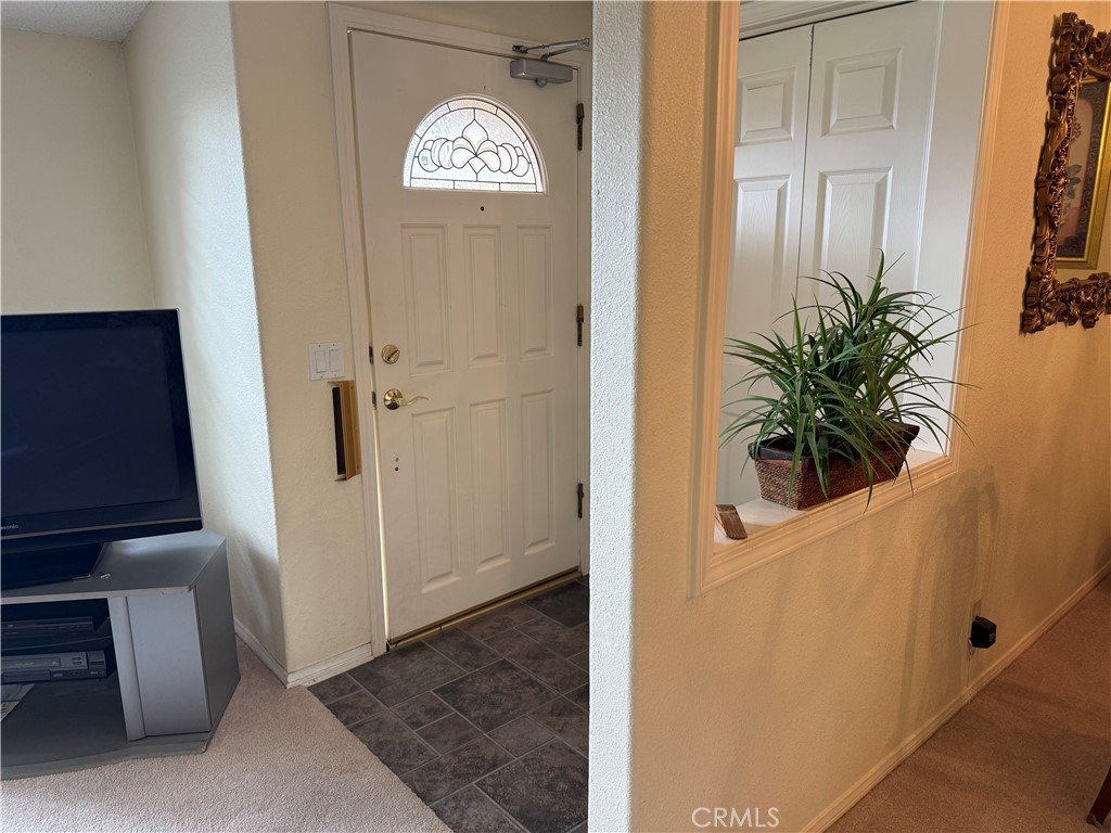 1441 Homewood Road Seal Beach, CA 90740 - Photo 3 of 25 a view of a hallway with entryway door