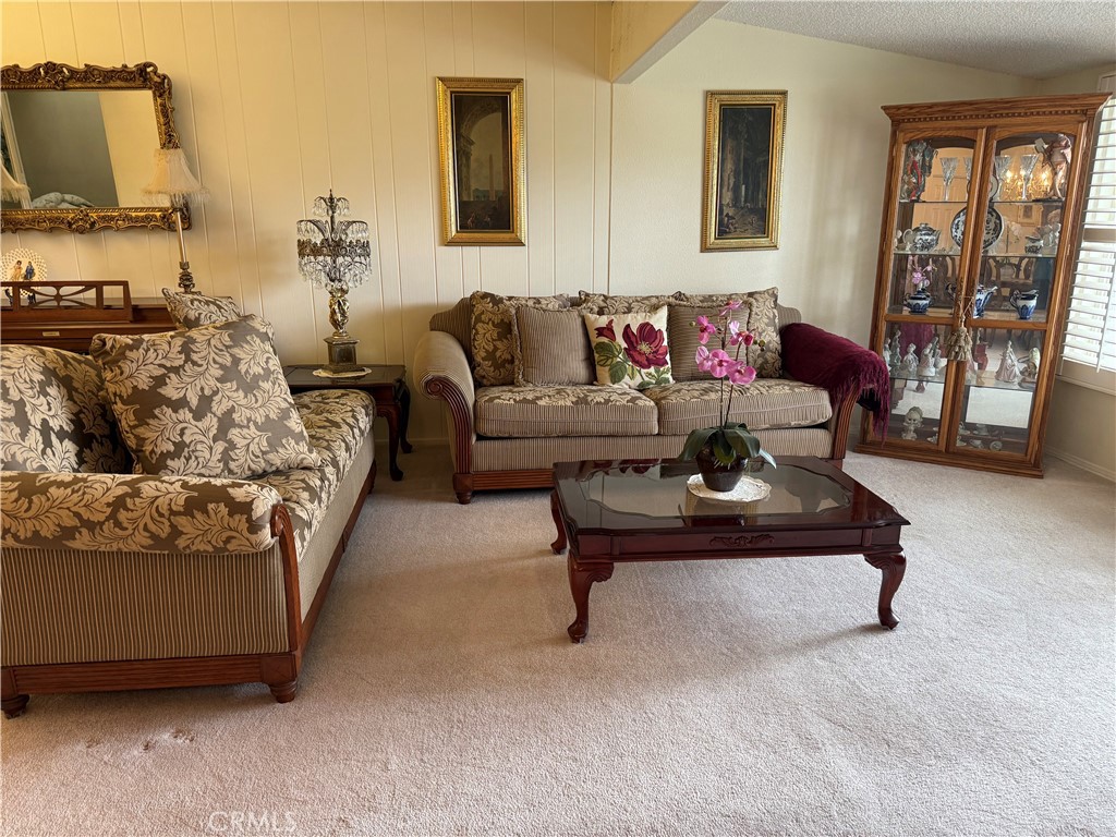 1441 Homewood Road Seal Beach, CA 90740 - Photo 5 of 25 a living room with furniture and a flat screen tv